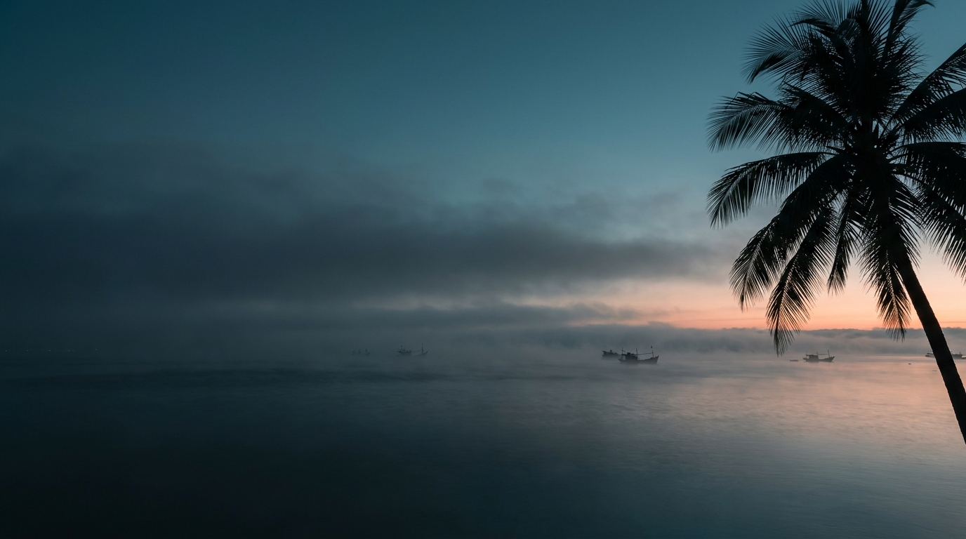 Vietnamese coast at dawn, mist over still water — the source environment for AEROVA's atmospheric water generator technology